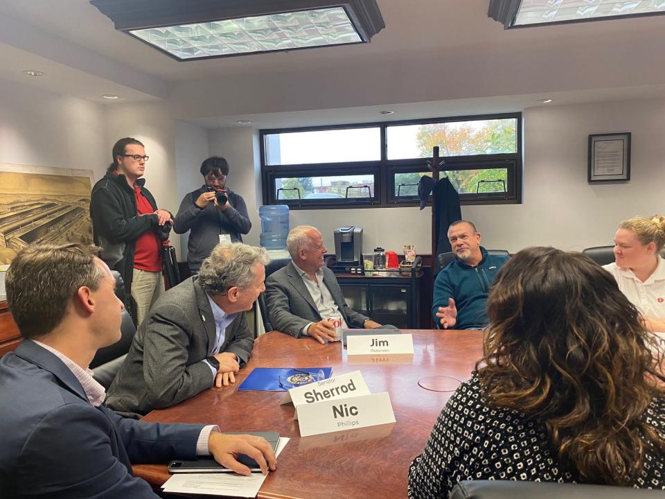 Sen.Sherrod Brown, D-Ohio, talks with Ideal Electric employee Mark Martin, who was born in Dayton, moved to Lexington, Ky., then Canada and moved back to Ohio. When Martin first worked at the company there were 300 employees, he told Brown.