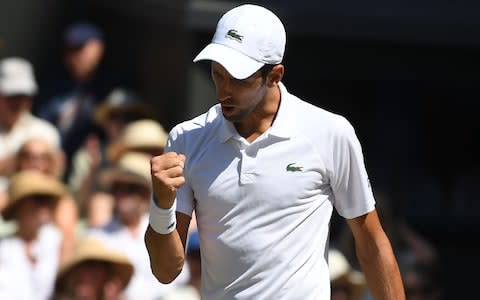 Serbia's Novak Djokovic celebrates taking the first set against South Africa's Kevin Anderson in their men's singles final match on the thirteenth day of the 2018 Wimbledon Championships at The All England Lawn Tennis Club in Wimbledon, southwest London, on July 15, 2018 - Credit: AFP