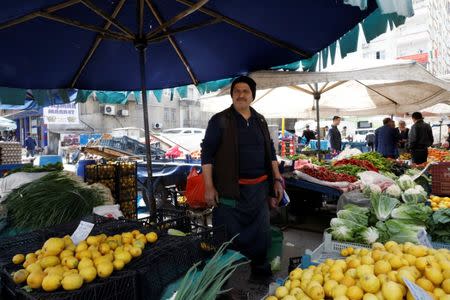 Street vendor Hikmet Gunduz, 52, who says he will vote Yes in the referendum, poses in front of his stall in Diyarbakir, Turkey, April 6, 2017. REUTERS/Umit Bektas