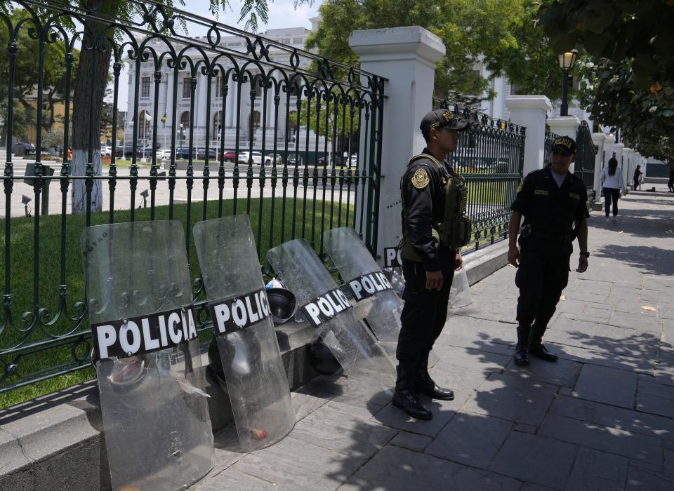 Police stand guard outside Congress in Lima, Peru, Monday, Jan. 30, 2023. Peru is amid political turmoil since former President Pedro Castillo was impeached and arrested for trying to dissolve Congress and succeeded by his Vice President Dina Boluarte, sparking protests. (AP Photo/Martin Mejia)