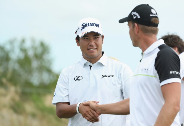 Hideki Matsuyama of Japan shakes hands with Henrik Stenson of Sweden before they play the first hole during the final round of the Hero World Challenge at Albany, The Bahamas on December 4, 2016