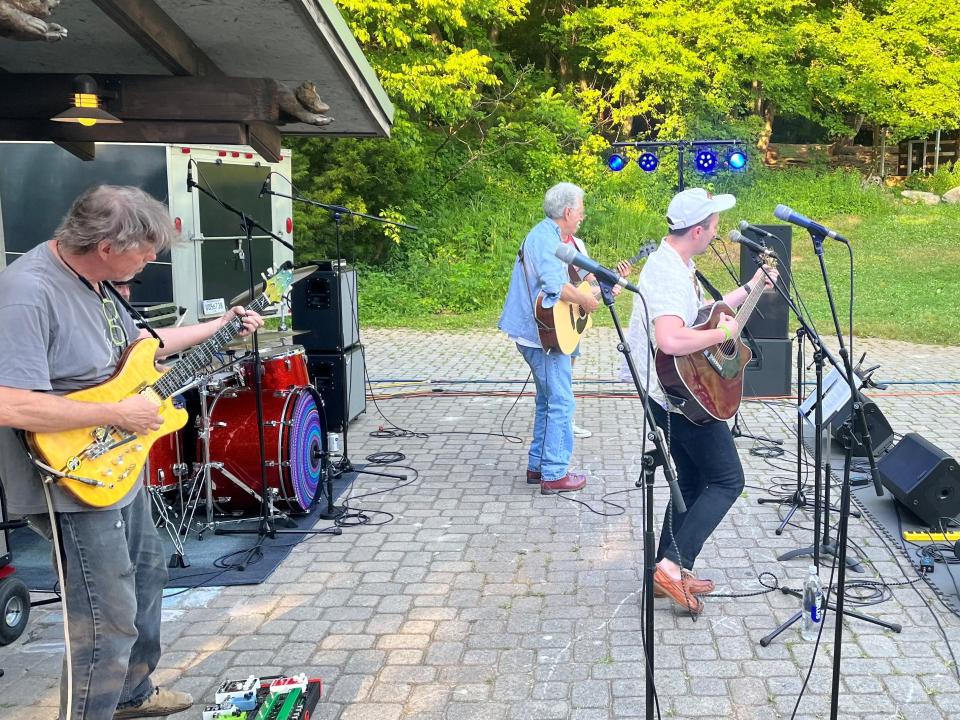 Will Horton, right, and Steve Horton, center, lead a set of tunes  at the  annual Bob Dylan Birthday Bash on June 3 at Ijams Nature Center. 2023