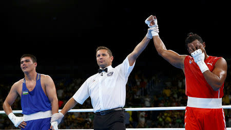 2016 Rio Olympics - Boxing - Final - Men's Middle (75kg) Final Bout 269 - Riocentro - Pavilion 6 - Rio de Janeiro, Brazil - 20/08/2016. Arlen Lopez Cardona (CUB) of Cuba reacts after winning his bout against Bektemir Melikuziev (UZB) of Uzbekistan. REUTERS/Peter Cziborra