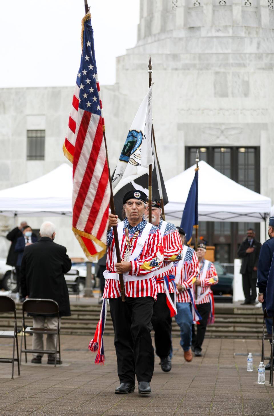 The Confederated Tribes of Grand Ronde Color Guard retires the colors during the Veterans Day ceremony at the Oregon State Capitol on Wednesday, Nov. 10, 2021 in Salem, Ore.