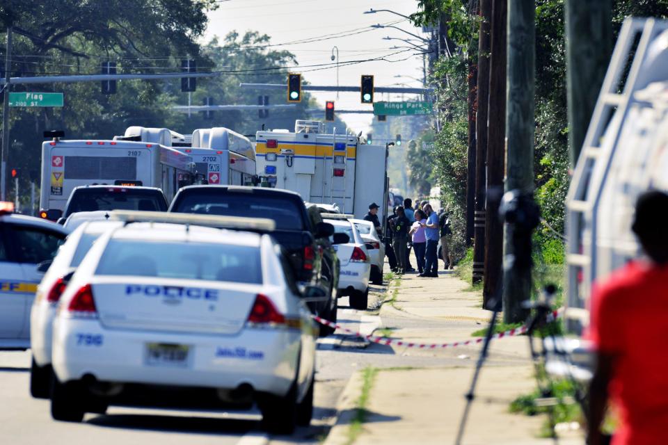 Emergency personnel surround the Dollar General store off Kings Road in Jacksonville, FL Saturday, August 26, 2023 after an individual reportedly shot and killed an unknown number of individuals and is also reported dead at the scene. [Bob Self/Florida Times-Union]
