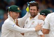 Australian bowler Ben Hilfenhaus (R) celebrates with teammates after dismissing West Indies batsman Carlton Baugh during the final day of the first-of-three Test matches between Australia and West Indies at the Kensington Oval stadium in Bridgetown on April 11, 2012. AFP PHOTO/Jewel Samad (Photo credit should read JEWEL SAMAD/AFP/Getty Images)