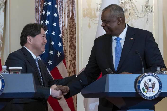 Japanese Foreign Minister Hayashi Yoshimasa, left, shakes hands with Secretary of Defense Lloyd Austin after a news conference at the State Department, Wednesday, Jan. 11, 2023, in Washington. (AP Photo/Alex Brandon)