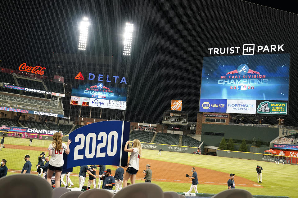 The Atlanta Braves celebrate after a baseball game to clinch the NL East title against the Miami Marlins on Tuesday, Sept. 22, 2020, in Atlanta. (AP Photo/Brynn Anderson)