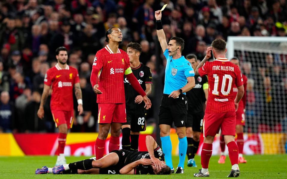 Virgil van Dijk is shown a yellow card