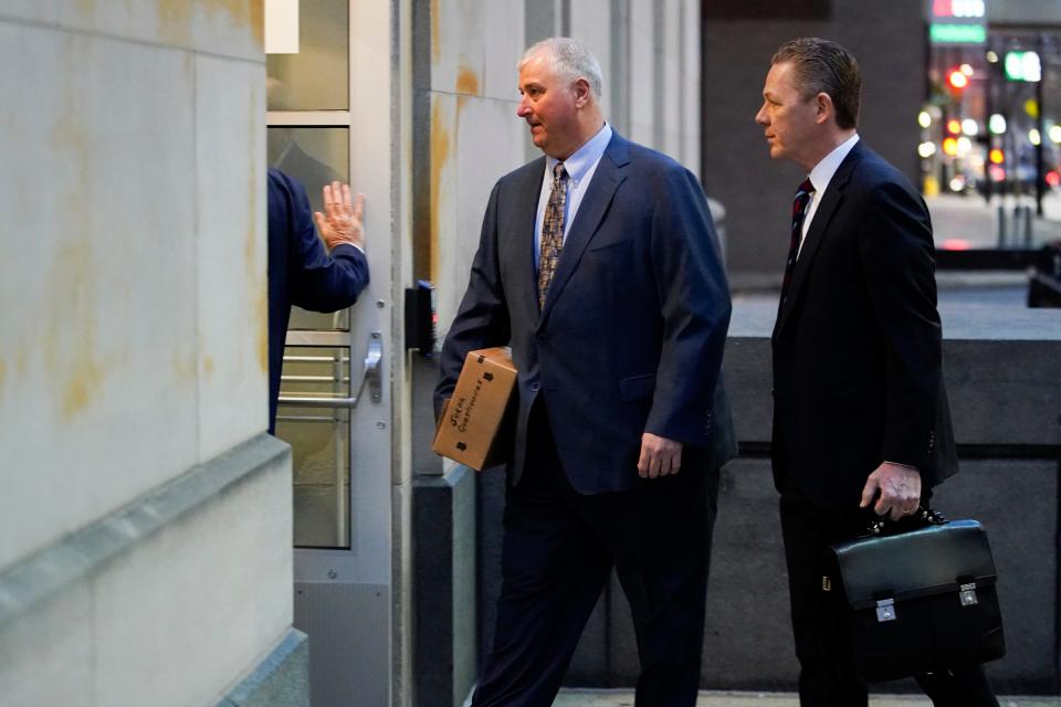 Former Ohio House Speaker Larry Householder, center, walks into Potter Stewart U.S. Courthouse with his attorneys, Mark Marein, left, and Steven Bradley, right, before jury selection in his federal trial, Friday, Jan. 20, 2023, in Cincinnati. Householder and former Ohio Republican Party chair Matt Borges are charged with racketeering in an alleged $60 million scheme to pass state legislation to secure a $1 billion bailout for two nuclear power plants owned by Akron, Ohio-based FirstEnergy. Householder and Borges have both pleaded not guilty. (AP Photo/Joshua A. Bickel)