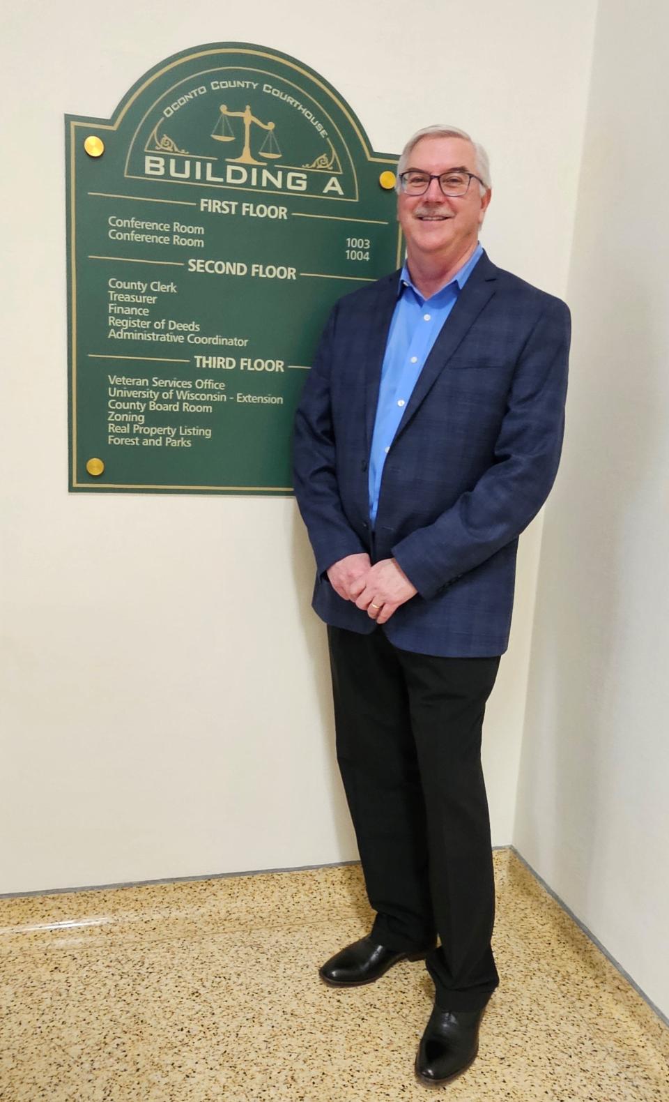 Richard Heath, posing in the Oconto County Courthouse and government building, takes over the the new county administrator April 22.