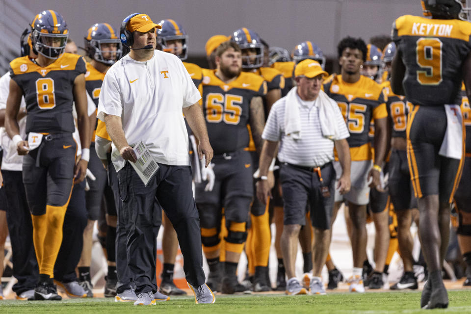 Tennessee head coach Josh Heupel, front left, watches play during the second half of an NCAA college football game against Austin Peay, Saturday, Sept. 9, 2023, in Knoxville, Tenn. (AP Photo/Wade Payne)
