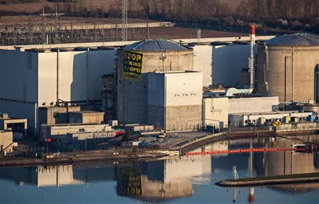 Greenpeace activists display an anti-nuclear banner after entering a nuclear power plant operated by EDF in Fessenheim, eastern France, March 18, 2014. REUTERS/Fred Dott/Greenpeace/Handout via Reuters