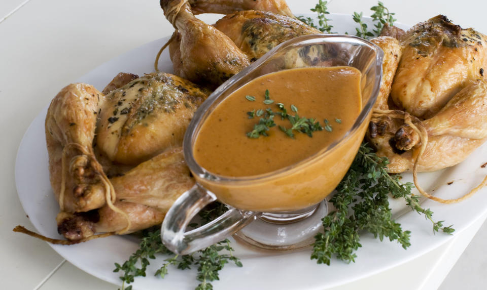 In this image taken on November 5, 2012, herb roasted Cornish game hens with creamy mustard sauce are shown served on a platter in Concord, N.H. (AP Photo/Matthew Mead)