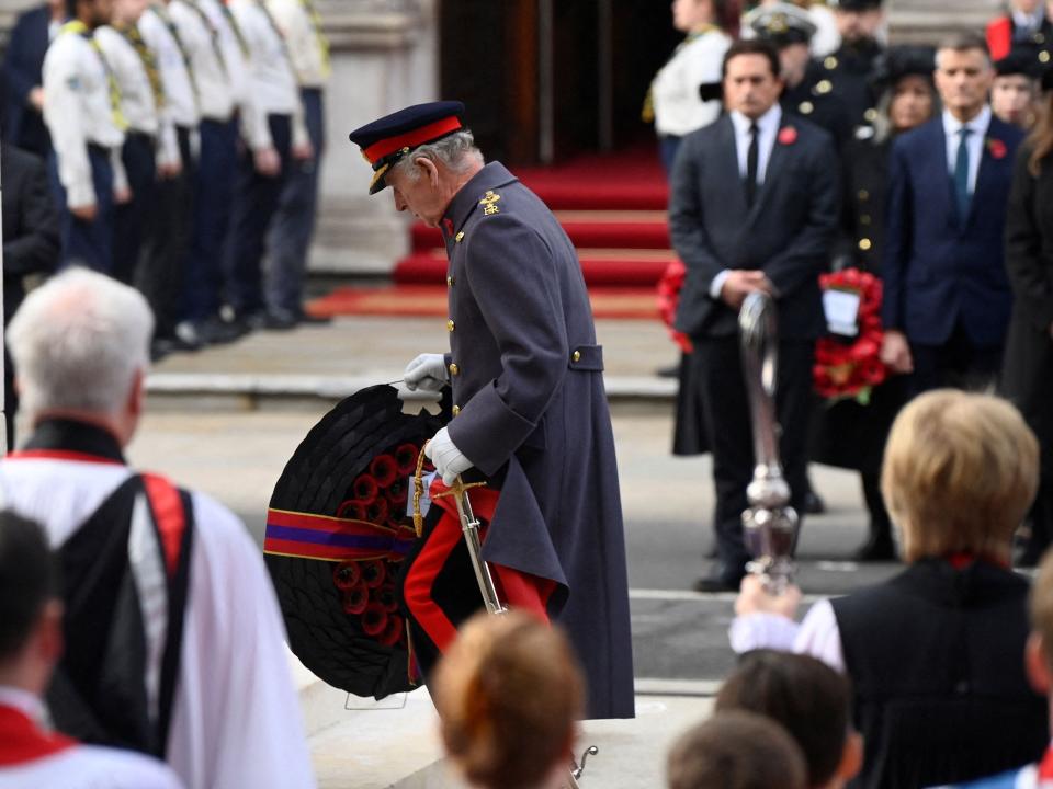 He knelt to deliver a wreath at the Cenotaph as per tradition.