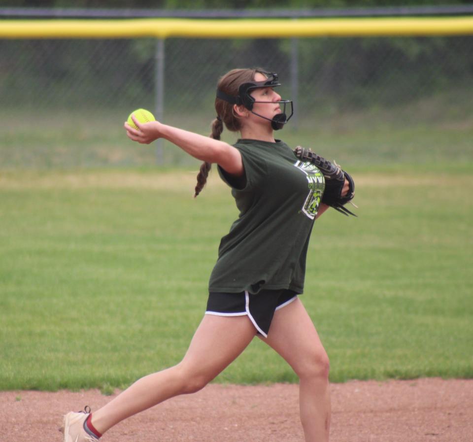 Inland Lakes freshman Eva Carper makes a throw to first base during Thursday's softball practice in Indian River.