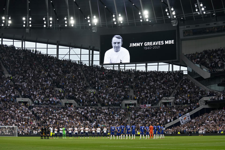 Players stand on the pitch applauding in a tribute to former player Jimmy Greaves before the English Premier League soccer match between Tottenham Hotspur and Chelsea at the Tottenham Hotspur Stadium in London, England, Sunday, Sep. 19, 2021. Greaves, one of England's greatest goal-scorers who was prolific for Tottenham, Chelsea and AC Milan has died. He was 81. Greaves was the all-time record scorer for Tottenham, which announced his death on Sunday. (AP Photo/Matt Dunham)