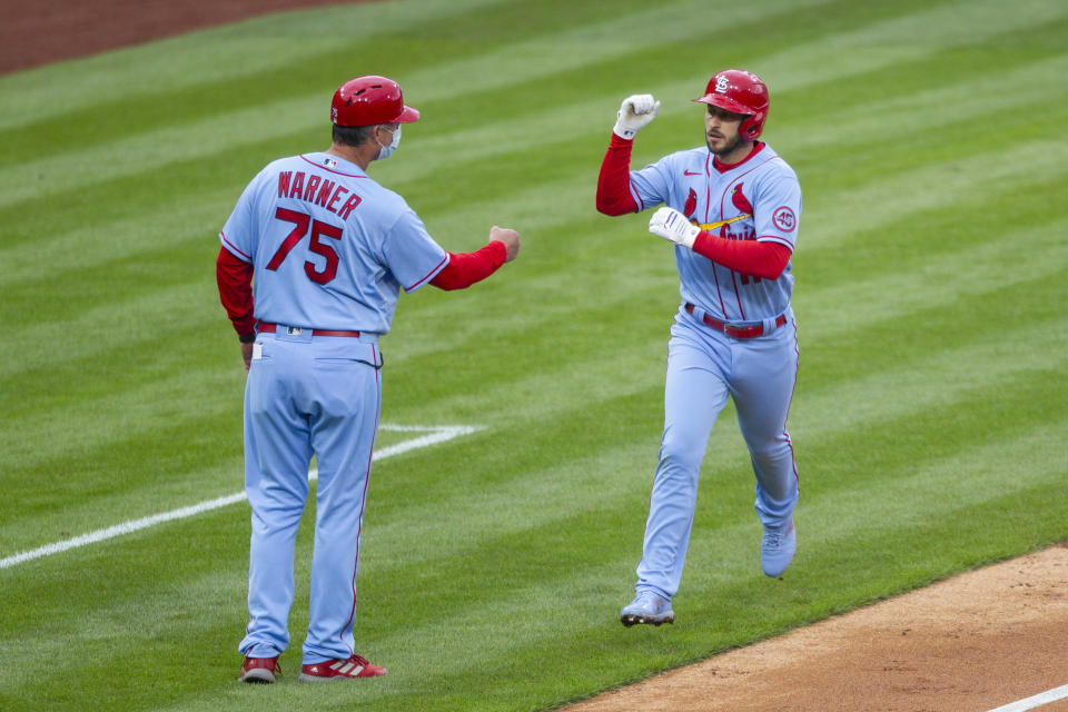 St. Louis Cardinals' Paul DeJong, right, is congratulated by third base coach Ron 'Pop' Warner, left, after hitting a home run during the third inning of a baseball game against the Philadelphia Phillies, Saturday, April 17, 2021, in Philadelphia. (AP Photo/Laurence Kesterson)