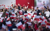 Polish President Duda greets his supporters after the second round of a presidential election in Pultusk