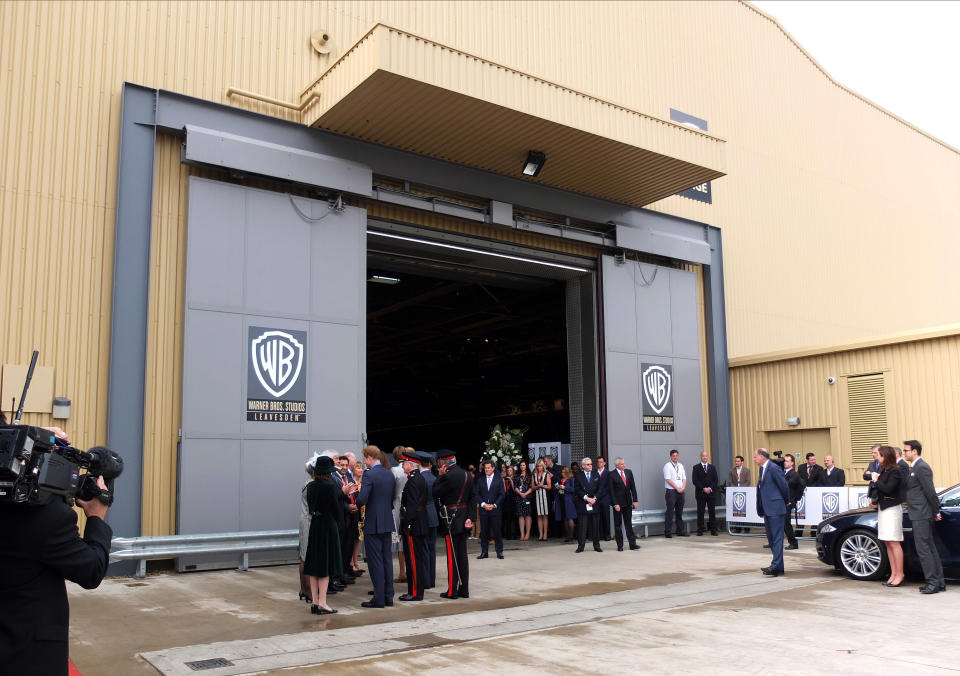 WATFORD, UNITED KINGDOM - APRIL 26: Prince William, Duke of Cambridge, Catherine, Duchess of Cambridge and Prince Harry attend the inauguration of Warner Bros. Studio Tour London on April 26, 2013 in Watford, England. (Photo by Karwai Tang/WireImage)