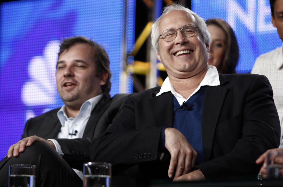 FILE - This Aug. 5, 2009 file photo shows actor Chevy Chase, right, laughs as executive producer and creator Dan Harmon looks on during the panel for "Community" at the NBC Universal Television Critics Association summer press tour in Pasadena, Calif. NBC said Monday, June 10, 2013, that show creator Dan Harmon will be joined by another former "Community" producer, Chris McKenna.Harmon was replaced as showrunner for season four after a clash with then-cast member Chevy Chase. (AP Photo/Matt Sayles, file)