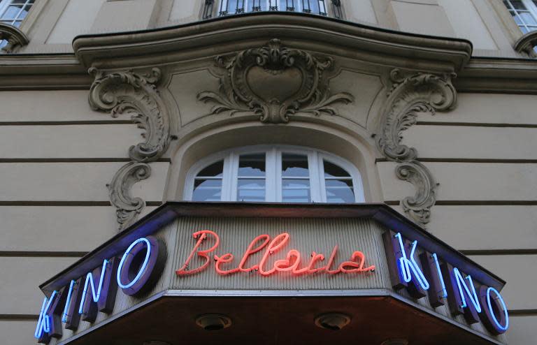 Neon signs at the Bellaria Kino movie theatre in Vienna are lit up on November 27, 2013