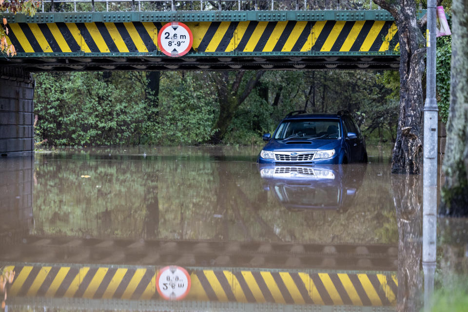 A car left abandoned under a flooded railway bridge in Dumbarton, West Dunbartonshire, as Scotland and northern parts of England are forecast to suffer extreme rainfall and flooding, whilst southern parts of the UK are set to bask in a late blast of summer over the weekend. The Met Office issued an amber weather warning for much of Scotland, and the Scottish Environmental Protection Agency (Sepa) warned against perceiving the situation as 