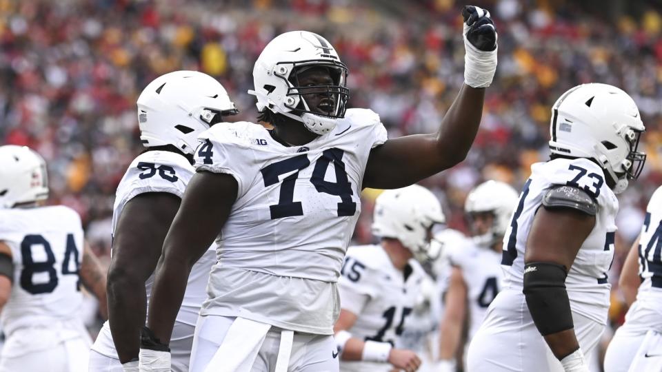 Nov 4, 2023; College Park, Maryland, USA; Penn State Nittany Lions offensive lineman Olumuyiwa Fashanu (74) celebrates after a first half touchdown against the Maryland Terrapins at SECU Stadium.