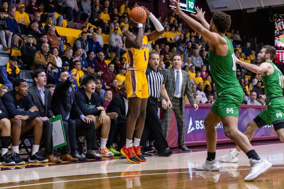 Iona's Wheza Panzo (1) pulls up for a three-pointer. Panzo finished 7-of-10 from beyond the arc in the Gaels' 73-63 win over Manhattan on Friday, Feb. 16, 2024.