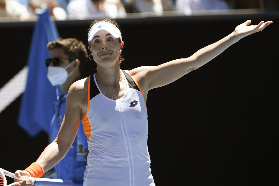 Alize Cornet of France reacts after defeating Tamara Zidansek of Slovenia in their third round match at the Australian Open tennis championships in Melbourne, Australia, Saturday, Jan. 22, 2022. (AP Photo/Andy Brownbill)