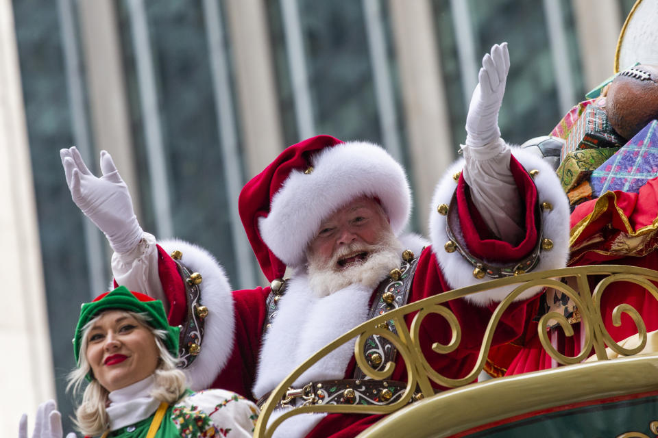 FILE - Santa Claus waves during the Macy's Thanksgiving Day Parade, Nov. 28, 2019, in New York. Macy's said Santa Claus won't be greeting kids at its flagship New York store this year due to the coronavirus, interrupting a holiday tradition started nearly 160 years ago. However, Macy's said the jolly old man will still appear at the end of the televised Macy's Thanksgiving Day parade. (AP Photo/Eduardo Munoz Alvarez, File)