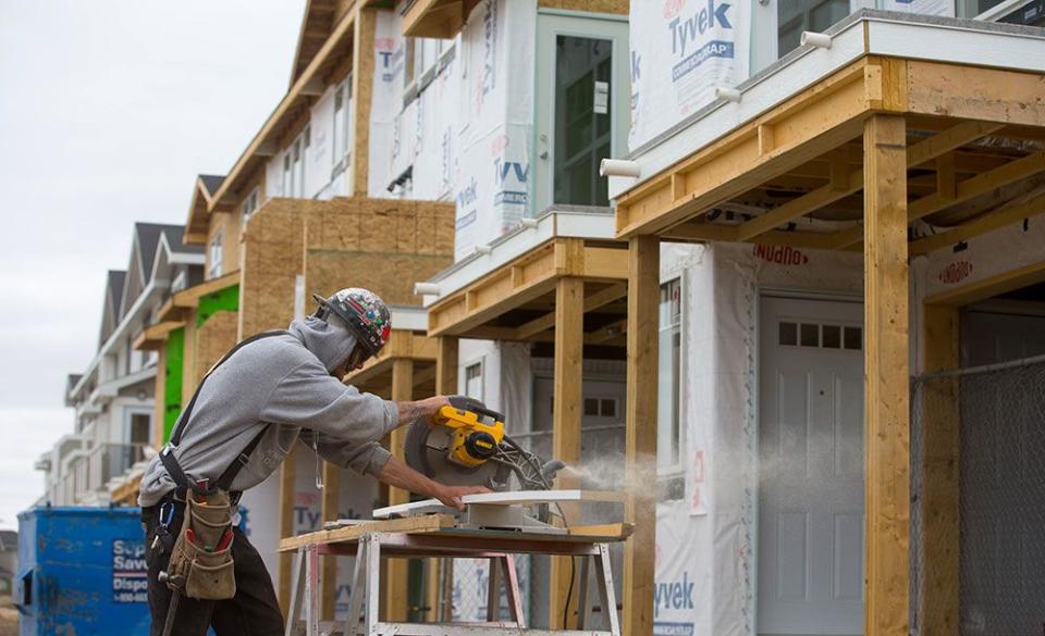  A carpenter works on a housing project in Saskatoon.