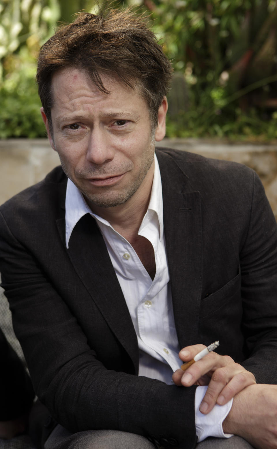 In this photo taken Sunday, May 19, 2013, actor Mathieu Amalric poses for photographs following an interview with The Associated Press at the 66th international film festival, in Cannes, southern France. Amalric depicts a maverick academic counseling Benicio Del Toro's Native American war vet in "Jimmy P.: Psychotherapy of a Plains Indian," director Arnaud Desplechin's Cannes Film Festival contender. (AP Photo/David Azia)