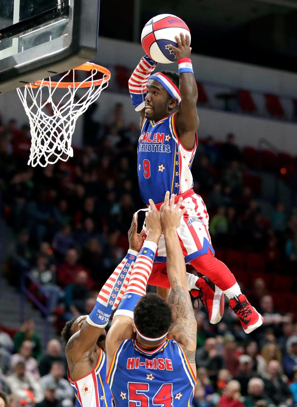 Hot Shot Swanson of the Harlem Globetrotters dunks the ball during a game against the Washington Generals on Dec. 28, 2019, at the Resch Center in Ashwaubenon.