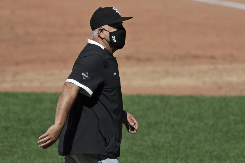 Chicago White Sox manager Rick Renteria walks back to the dugout from the pitcher's mound in the third inning in the first baseball game of a doubleheader against the Cleveland Indians, Tuesday, July 28, 2020, in Cleveland. (AP Photo/Tony Dejak)