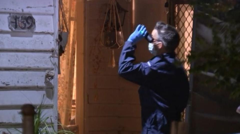 Forensic investigators were processing the scene on Friday night. Photo: Nine News