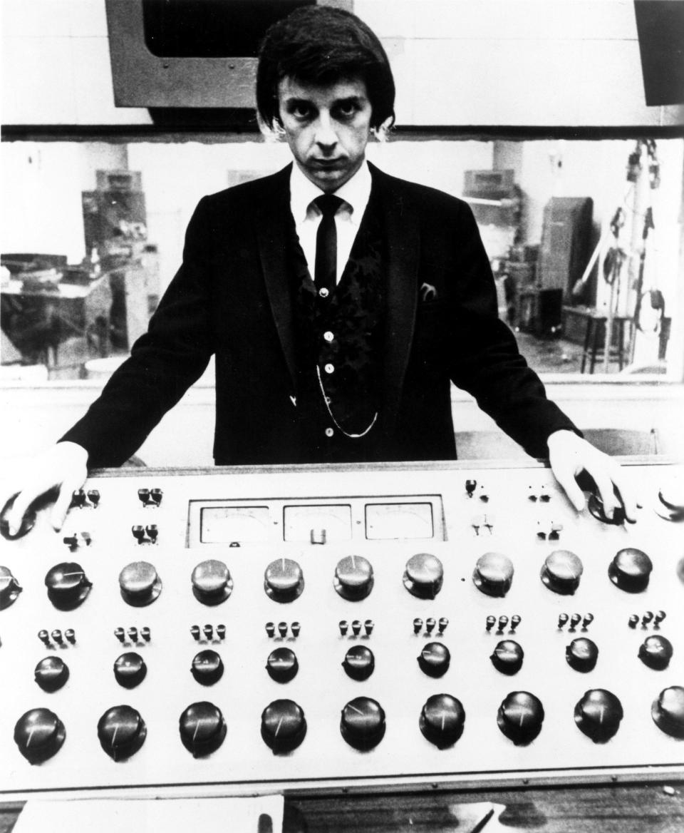 Phil Spector poses at the mixing board during a recording session at Gold Star Studios in 1966 - Michael Ochs Archives