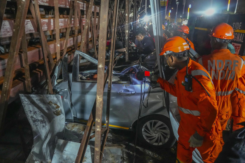 Scores of people were thought to be trapped after the collapse in the suburb of Ghatkopar, Mumbai police said on social media platform X.  (Rafiq Maqbool / AP)
