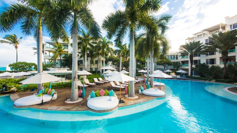 The Palms Turks and Caicos is an upscale resort steps from Grace Bay Beach.