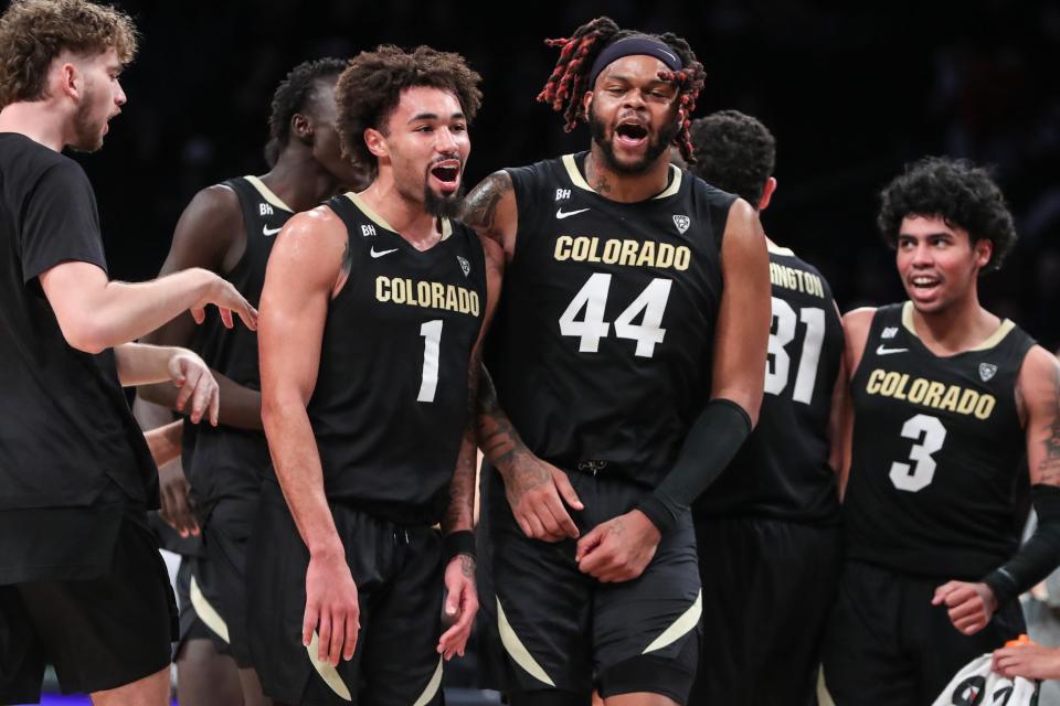 Dec 10, 2023; Brooklyn, New York, USA; Colorado Buffaloes guard J'Vonne Hadley (1) and center Eddie Lampkin Jr. (44) celebrate during a timeout in the second half against the Miami (Fl) Hurricanes at Barclays Center. Mandatory Credit: Wendell Cruz-USA TODAY Sports