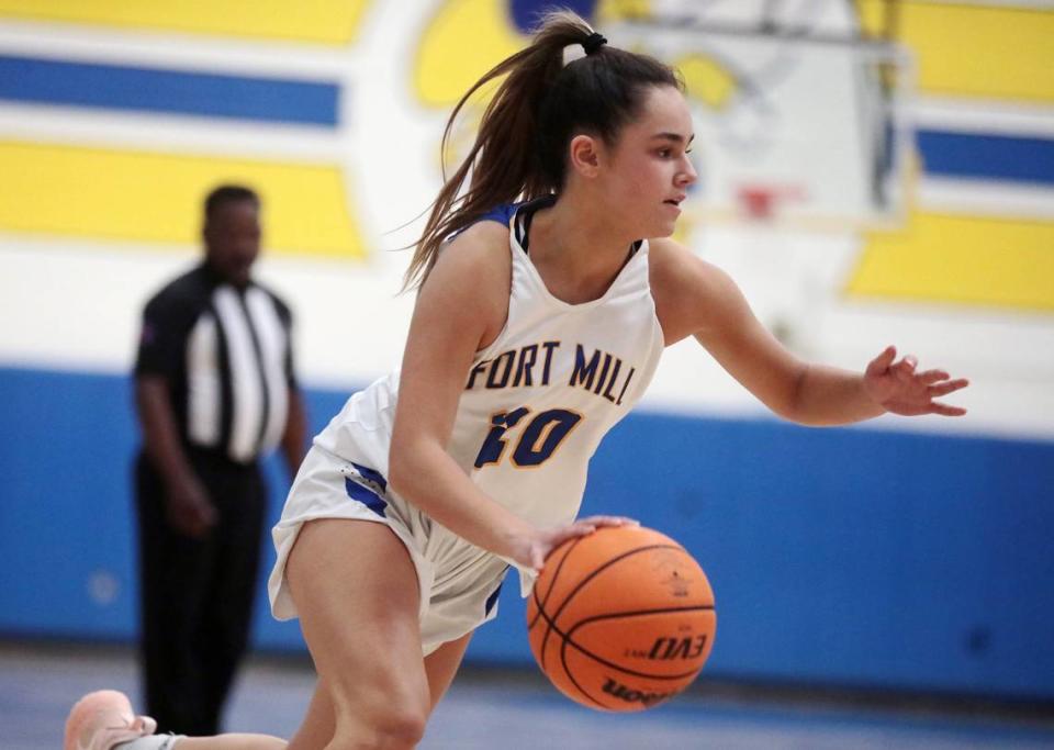 Fort Mill’s Claire Moore heads to the basket.