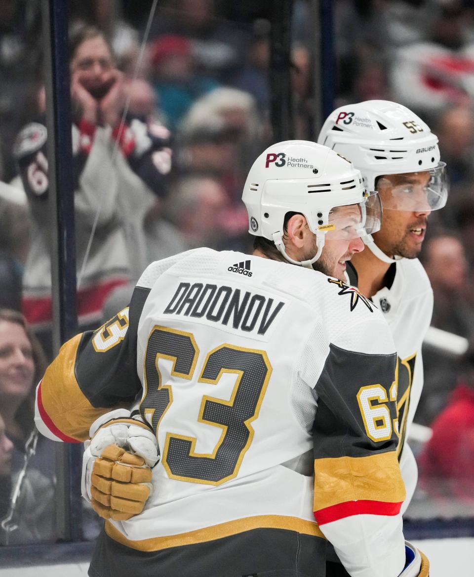 Sun., Mar. 13, 2022; Columbus, Ohio, USA; Vegas Golden Knights right wing Evgenii Dadonov (63) celebrates with teammate Vegas Golden Knights right wing Keegan Kolesar (55) after a goal during the second period of a NHL game between the Columbus Blue Jackets and the Vegas Golden Knights at Nationwide Arena. 