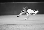 FILE - In this June 3, 1981 file photo, Philadelphia Phillies' Pete Rose slides to third base during a baseball game against the New York Mets in Philadelphia. Rose says cheating on the field is bad for the game, and the one thing he never did with his bets is change the outcome of a game. (AP Photo/Rusty Kennedy, File)