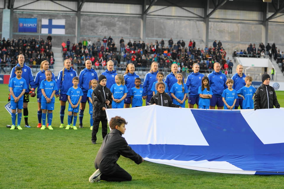 BIEL, SWITZERLAND - APRIL 05: Team of Finland behind the Finland flag during their national anthem prior the international friendly football match between Switzerland Women and Finland Women at Tissot-Arena on April 5, 2019 in Biel, Switzerland. (Photo by Daniela Porcelli/Getty Images)