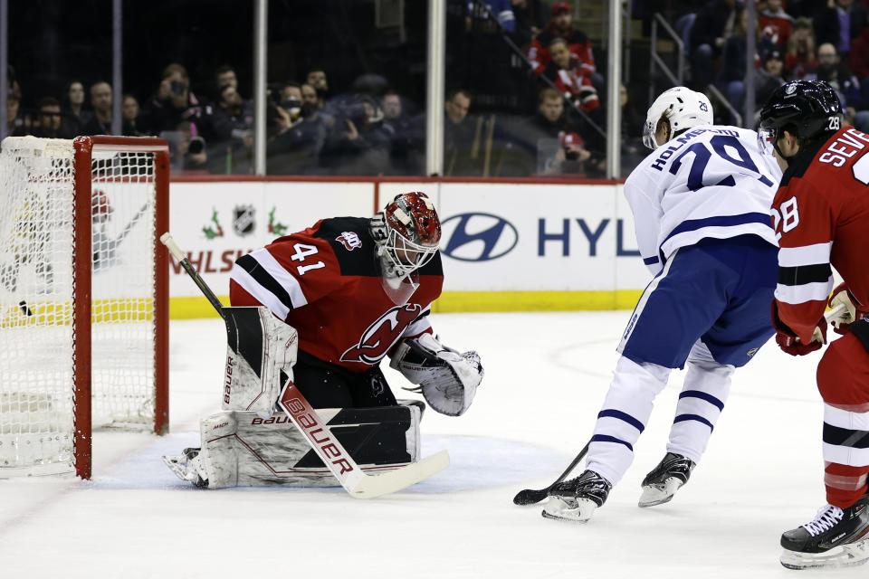 Toronto Maple Leafs right wing Pontus Holmberg (29) scores a goal past New Jersey Devils goaltender Vitek Vanecek during the first period of an NHL hockey game Wednesday, Nov. 23, 2022, in Newark, N.J. (AP Photo/Adam Hunger)