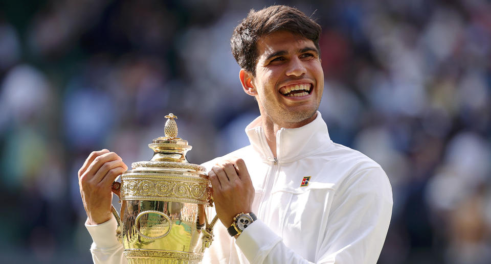 Seen here, Carlos Alcaraz holding his Wimbledon trophy after winning the men's final.