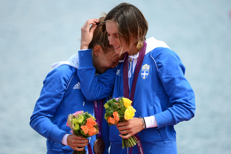 WINDSOR, ENGLAND - AUGUST 04: Bronze medalists Alexandra Tsiavou and Christina Giazitzidou of Greece celebrate with their medals during the medal ceremony for the Lightweight Women's Double Sculls Final on Day 8 of the London 2012 Olympic Games at Eton Dorney on August 4, 2012 in Windsor, England. (Photo by Harry How/Getty Images)