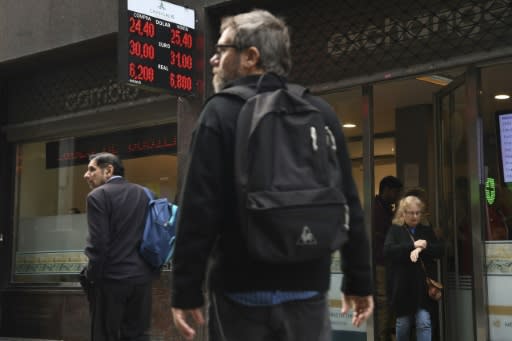 The Argentine peso, on display in a buy-sell board in Buenos Aires, has lost 20 percent of its value over a six-week period