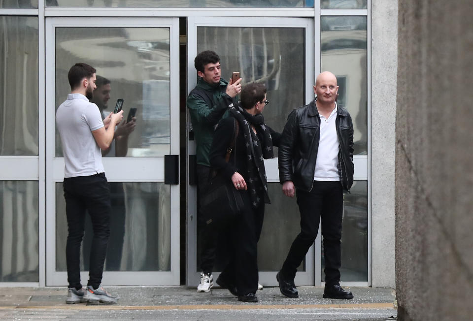 Steve Bouquet (right) is escorted away from Brighton Magistrates Court after appearing on 16 counts of criminal damage over attacks in Brighton on cats between October 2018 and June 2019.