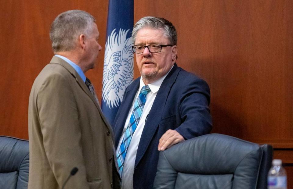 Horry County Council Chairman Johnny Gardner speaks with fellow councilman Al Allen before the start of a council meeting Tuesday at the Horry County Courthouse in Conway.